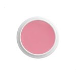 Top-down view of a white round cosmetic jar filled with pink cream.