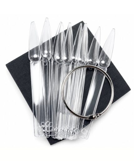 Clear plastic pipettes fanned out on a dark square background, with a silver circular ring resting over them.