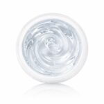 Top-down view of a clear gel in an open jar with a swirling texture on a white background