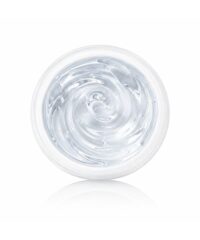 Top-down view of a clear gel in an open jar with a swirling texture on a white background
