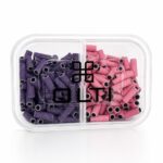 Clear plastic two-compartment container filled with purple and pink hollow-tube snacks; brand logo on lid.