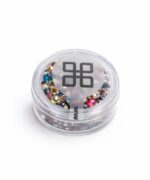 Clear round jar filled with multicolored rhinestones for nail art