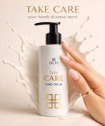 Bottle of OLTI Take Care hand cream with black pump, cream splash behind, and a hand with pink nails; text reads 'Take CARE' and 'Hand Cream'.