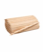Pile of natural wood pencils stacked in parallel with sharpened tips on a white background, one pencil resting across the front.