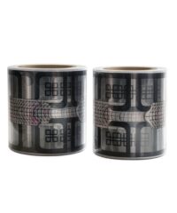 Two rolls of decorative black patterned tape with geometric grid motifs and abstract shapes, standing side by side on a white background.