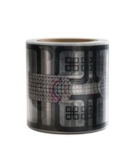 Decorative black and gray washi tape roll with abstract geometric patterns wrapped around the surface